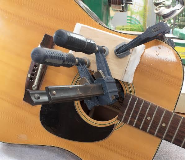 illustrative image of DIY acoustic guitar crack repair